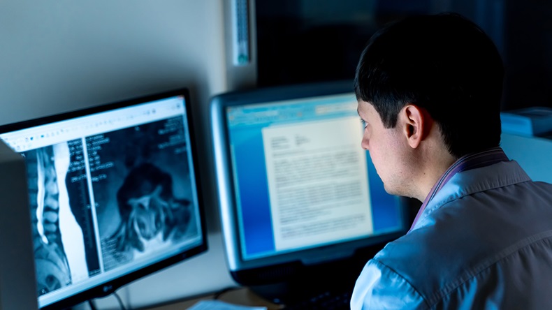Radiologist working at computer in office