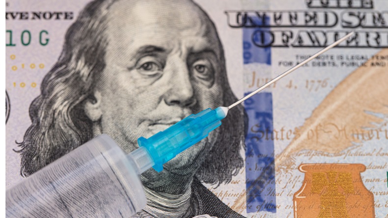 dollar bill with vaccine